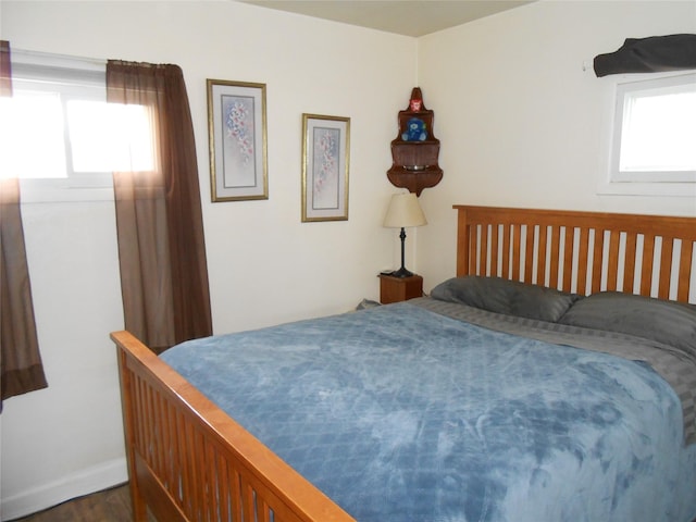 1426 2nd Ave NW, Great Falls, MT 59404 - bedroom with dark wood-style flooring, baseboards, and multiple windows