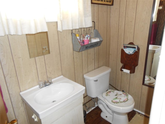 1426 2nd Ave NW, Great Falls, MT 59404 - half bathroom with toilet, wood walls, and vanity