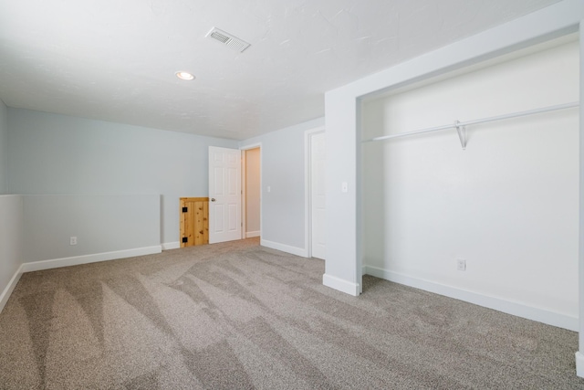 unfurnished bedroom with carpet floors, baseboards, and recessed lighting