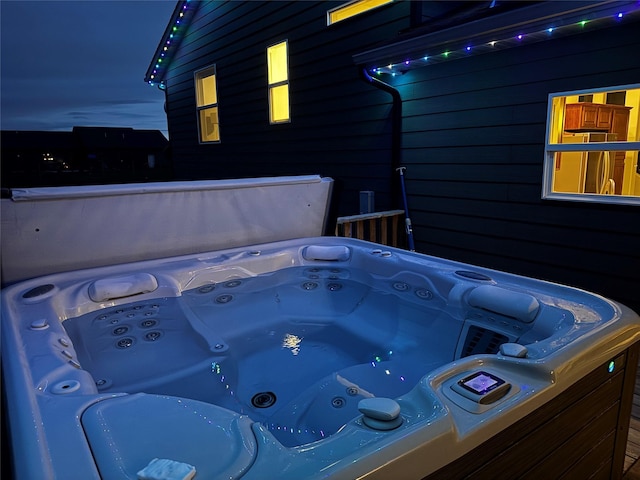 view of patio / terrace with a hot tub