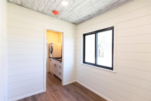 interior space with wooden ceiling, dark wood-type flooring, and wooden walls