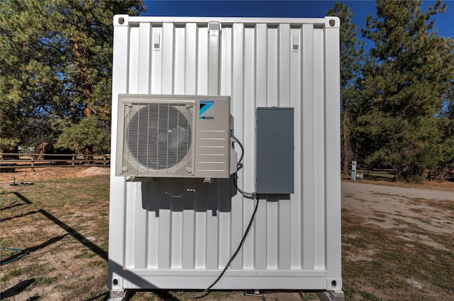 exterior details featuring fence and ac unit