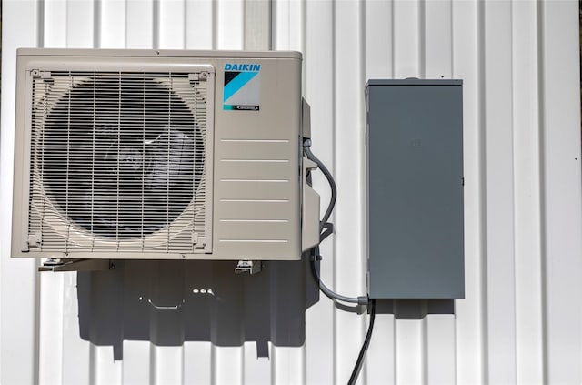exterior details with ac unit and board and batten siding