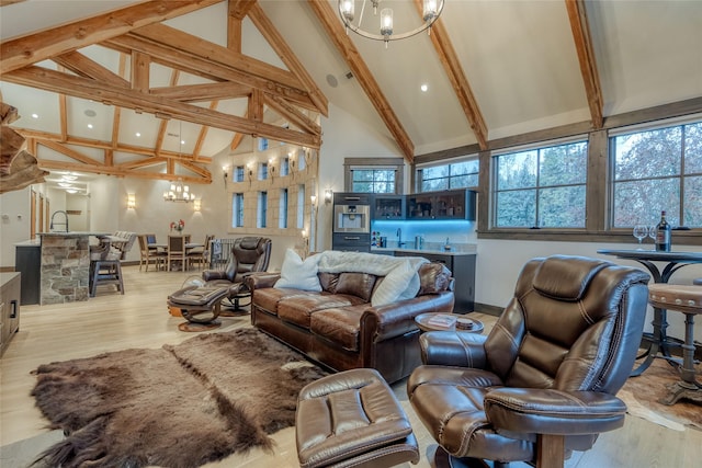 30 Bear Dance Vlg, Bigfork, MT 59911 - living area featuring a chandelier, beam ceiling, high vaulted ceiling, wood finished floors, and wet bar