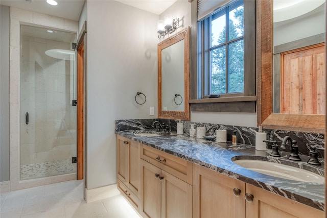 30 Bear Dance Vlg, Bigfork, MT 59911 - full bath with a shower stall, double vanity, plenty of natural light, and tile patterned floors