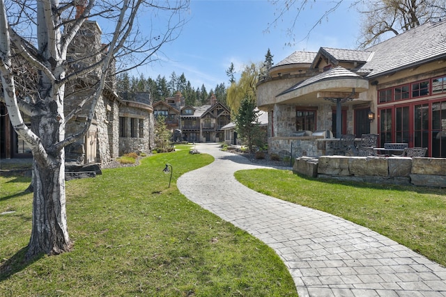 30 Bear Dance Vlg, Bigfork, MT 59911 - view of home's community with a yard and a patio area