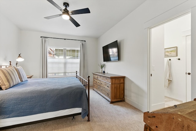 bedroom featuring a ceiling fan, baseboards, and light carpet