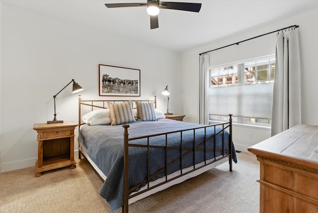 carpeted bedroom with baseboards and ceiling fan