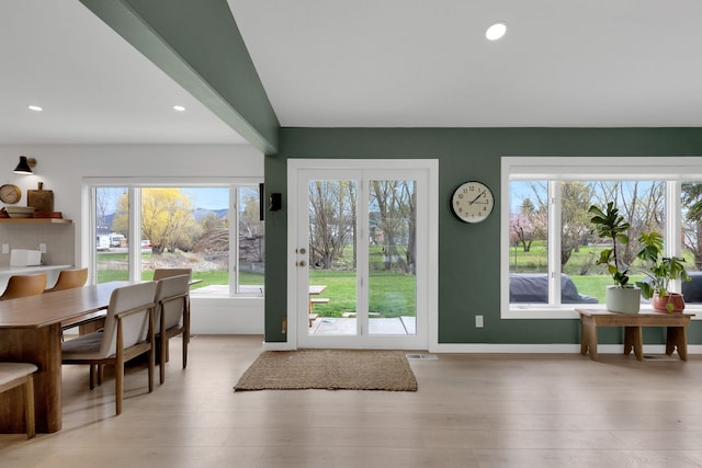 doorway featuring a wealth of natural light, light wood-type flooring, and recessed lighting