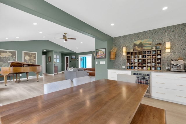 dining area with vaulted ceiling, a ceiling fan, light wood-style floors, wine cooler, and recessed lighting