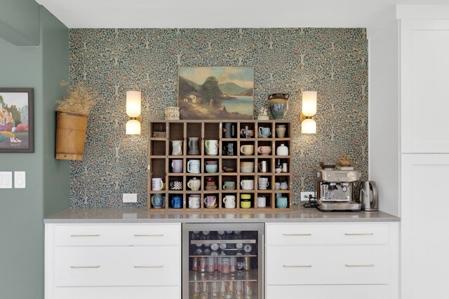 bar featuring decorative backsplash and wine cooler