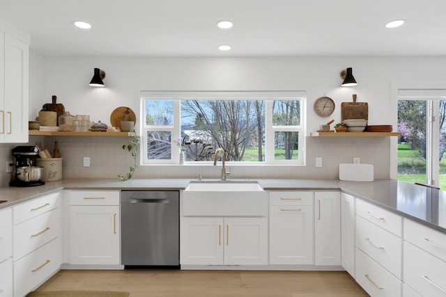 kitchen with open shelves, dishwasher, recessed lighting, and a sink