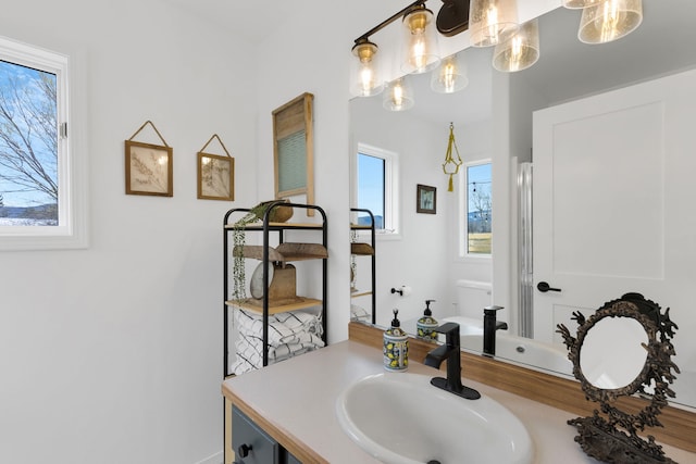 bathroom featuring vanity and toilet