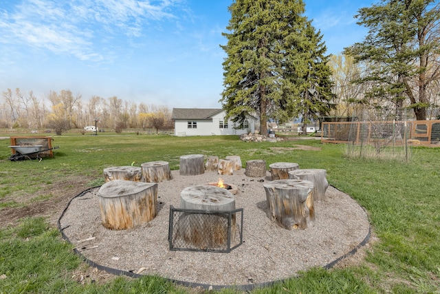 view of yard with an outdoor fire pit