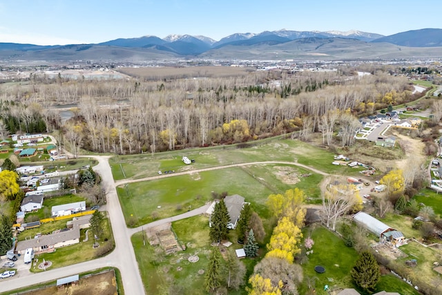 birds eye view of property with a mountain view