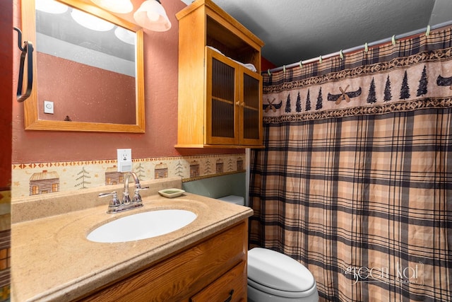 62 Limber Pne, Whitefish, MT 59937 - bathroom featuring vanity, a shower with shower curtain, and toilet