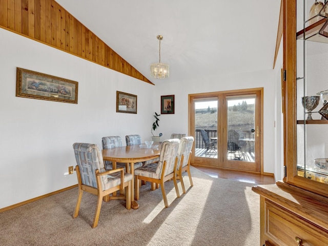 3600 Fairmont Rd, Anaconda, MT 59711 - dining space with baseboards, vaulted ceiling, carpet flooring, and an inviting chandelier