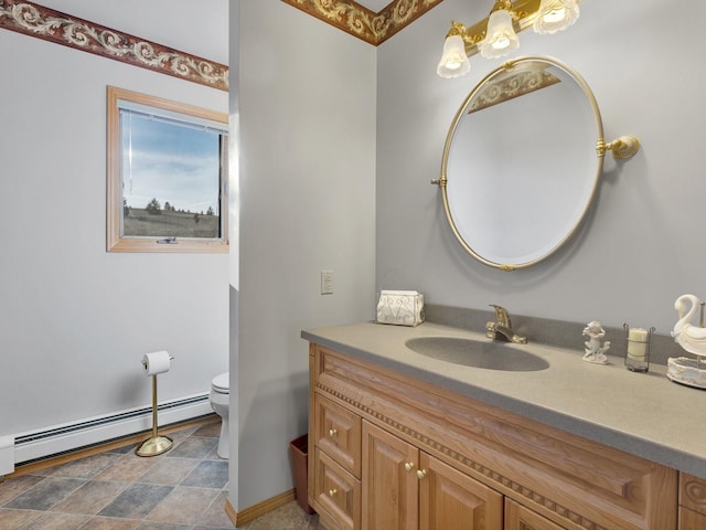 3600 Fairmont Rd, Anaconda, MT 59711 - bathroom with toilet, baseboards, stone finish flooring, vanity, and a baseboard radiator