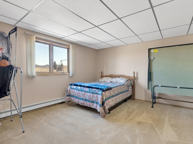 3600 Fairmont Rd, Anaconda, MT 59711 - carpeted bedroom featuring a baseboard heating unit, baseboards, and a drop ceiling