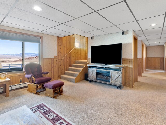 3600 Fairmont Rd, Anaconda, MT 59711 - living room with wainscoting, wooden walls, carpet floors, and stairs