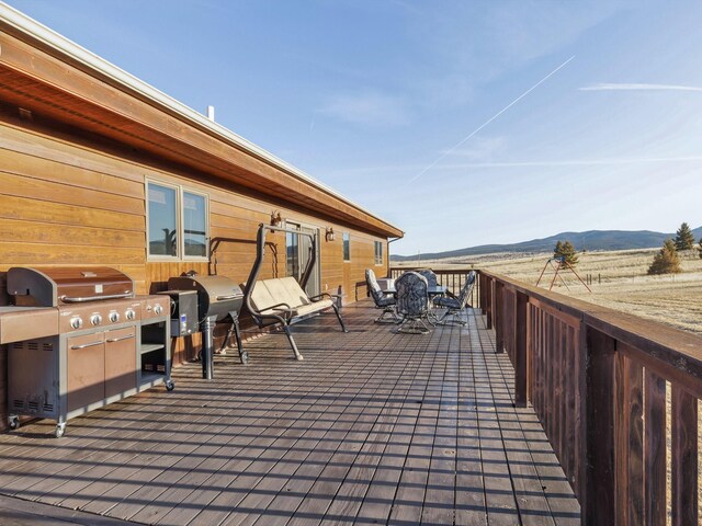 3600 Fairmont Rd, Anaconda, MT 59711 - view of patio featuring a grill, outdoor dining space, and a mountain view