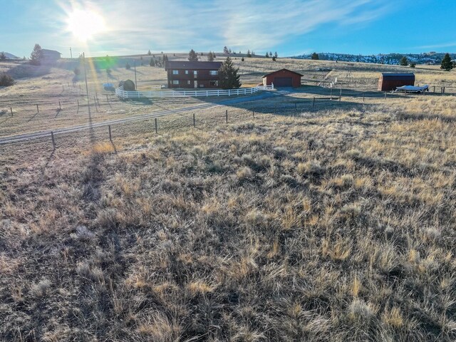 3600 Fairmont Rd, Anaconda, MT 59711 - view of yard featuring fence, an outbuilding, and a rural view