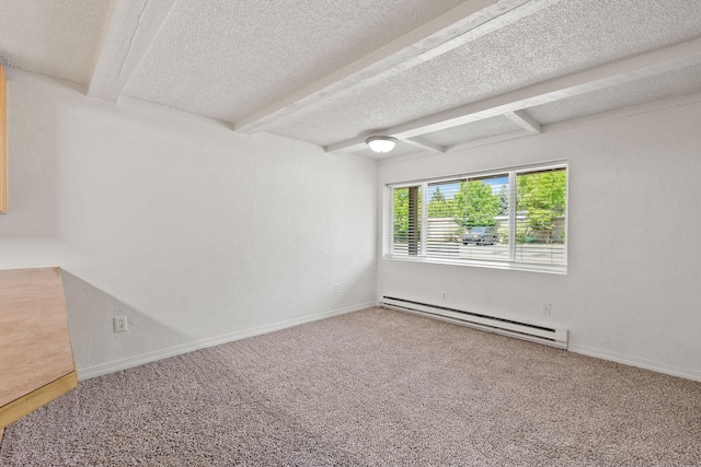 121 Iowa Ave Unit 1G, Whitefish, MT 59937 - carpeted empty room featuring a baseboard radiator, beam ceiling, and a textured ceiling
