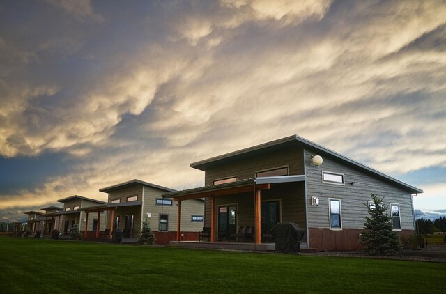 2360 Mt Highway 206, Columbia Falls, MT 59912 - rear view of house featuring a lawn