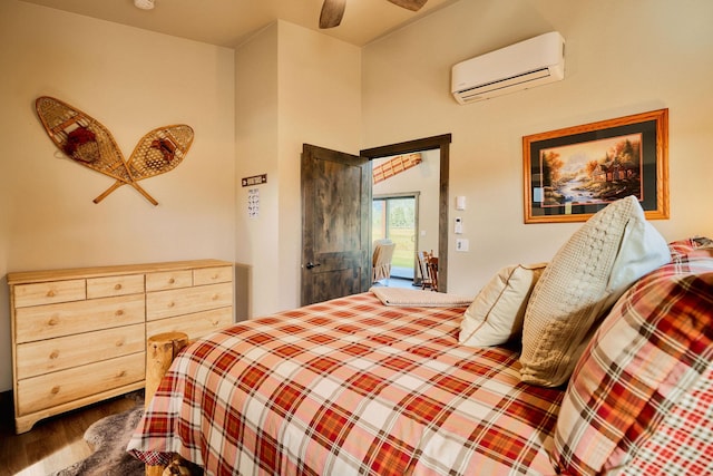 2360 Mt Highway 206, Columbia Falls, MT 59912 - bedroom with a wall mounted air conditioner, dark wood-style floors, access to outside, and a ceiling fan
