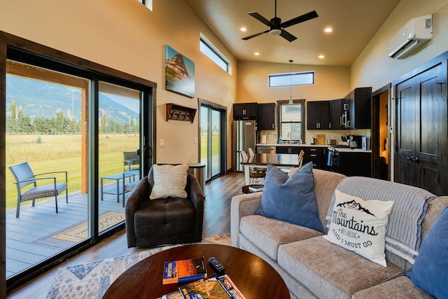 2360 Mt Highway 206, Columbia Falls, MT 59912 - living room with a wall mounted AC, healthy amount of natural light, dark wood finished floors, a ceiling fan, and recessed lighting
