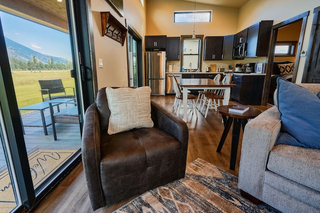 2360 Mt Highway 206, Columbia Falls, MT 59912 - living area featuring dark wood-type flooring, high vaulted ceiling, and a mountain view