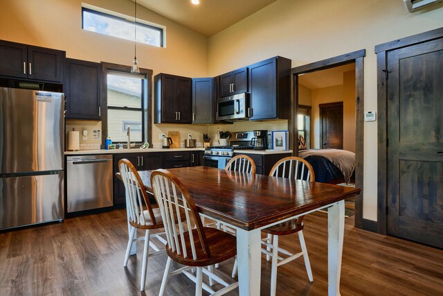 2360 Mt Highway 206, Columbia Falls, MT 59912 - dining area featuring high vaulted ceiling and dark wood finished floors