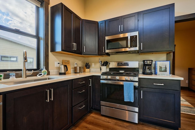 2360 Mt Highway 206, Columbia Falls, MT 59912 - kitchen featuring appliances with stainless steel finishes, healthy amount of natural light, light countertops, and dark wood-style flooring