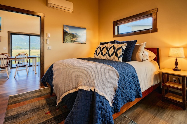 2360 Mt Highway 206, Columbia Falls, MT 59912 - bedroom with a wall mounted air conditioner and wood finished floors