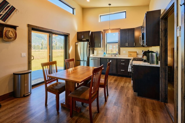 2360 Mt Highway 206, Columbia Falls, MT 59912 - dining room featuring dark wood finished floors and a high ceiling