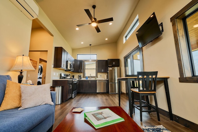 2360 Mt Highway 206, Columbia Falls, MT 59912 - living area with stacked washer / dryer, a wall mounted air conditioner, a ceiling fan, dark wood-style floors, and recessed lighting