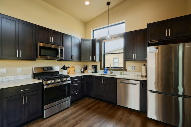2360 Mt Highway 206, Columbia Falls, MT 59912 - kitchen with stainless steel appliances, light countertops, high vaulted ceiling, pendant lighting, and dark wood-style flooring
