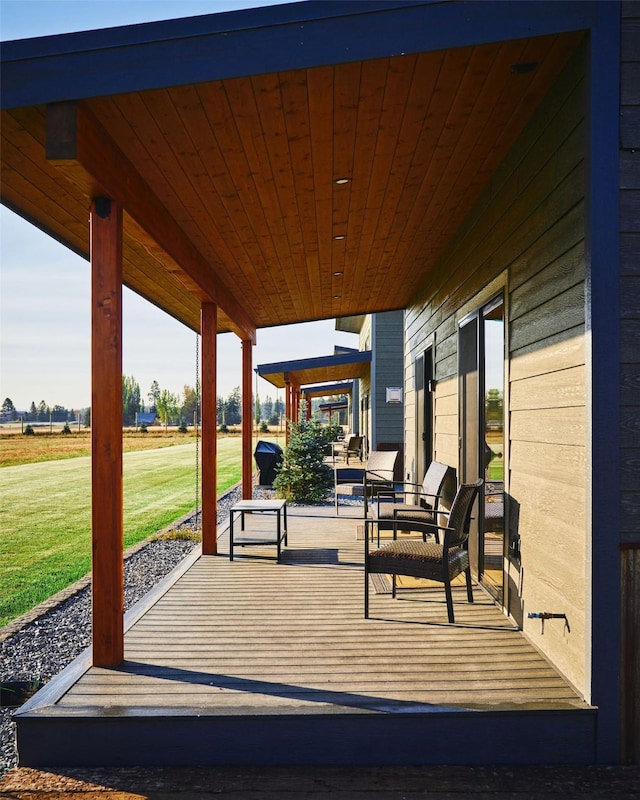 2360 Mt Highway 206, Columbia Falls, MT 59912 - wooden porch with a lawn