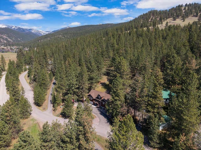 aerial view with a view of trees and a mountain view
