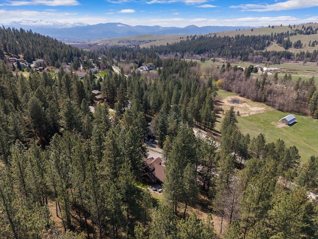 bird's eye view with a view of trees and a mountain view
