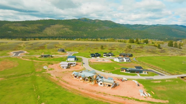 aerial view with a view of trees and a mountain view