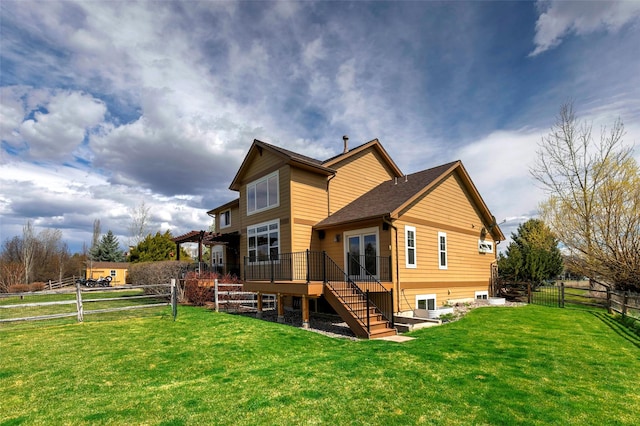 2200 Rafferty Ln, Missoula, MT 59804 - rear view of property with a fenced backyard, stairway, and a wooden deck