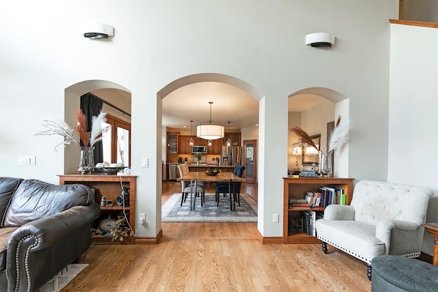 2200 Rafferty Ln, Missoula, MT 59804 - living room with light wood finished floors, a towering ceiling, and arched walkways