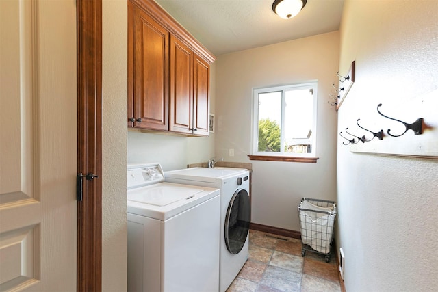 2200 Rafferty Ln, Missoula, MT 59804 - laundry area with cabinet space, separate washer and dryer, and light stone finish flooring