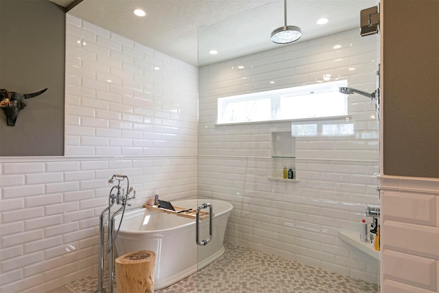 2200 Rafferty Ln, Missoula, MT 59804 - bathroom with tile walls, a freestanding tub, a tile shower, and recessed lighting