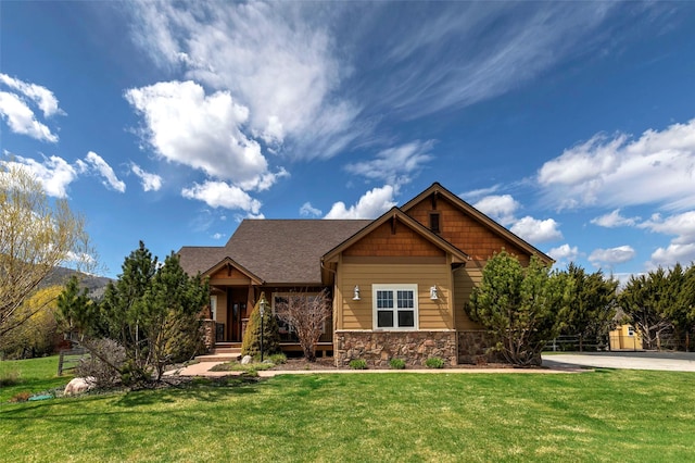 2200 Rafferty Ln, Missoula, MT 59804 - craftsman inspired home featuring stone siding, a front yard, and a porch