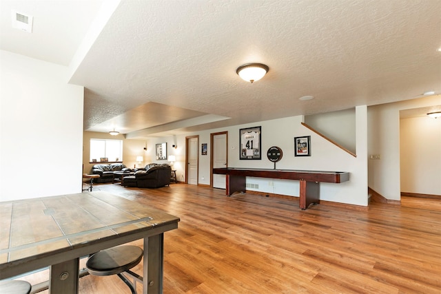 2200 Rafferty Ln, Missoula, MT 59804 - dining area featuring a textured ceiling, light wood-style floors, and stairs