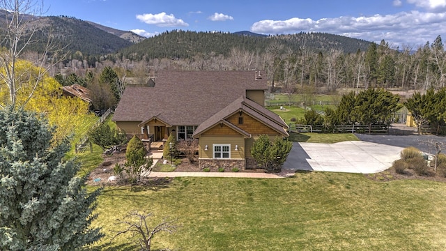 2200 Rafferty Ln, Missoula, MT 59804 - view of front of house with a mountain view, stone siding, and covered porch