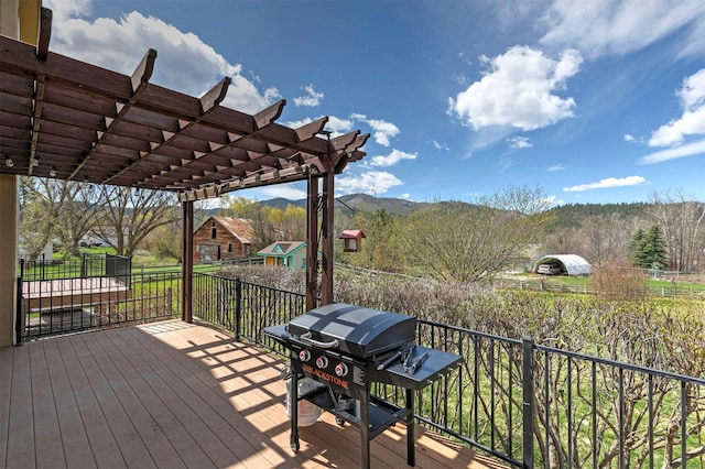 2200 Rafferty Ln, Missoula, MT 59804 - wooden terrace featuring area for grilling, a pergola, and an outdoor structure
