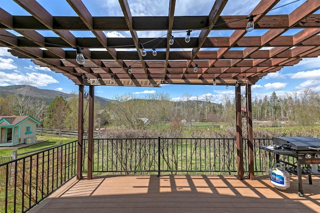 2200 Rafferty Ln, Missoula, MT 59804 - deck with a pergola, grilling area, a mountain view, and a forest view